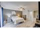 Comfortable main bedroom with neutral tones, a ceiling fan, and natural light at 643 Oregon Woods Ct, Orlando, FL 32824