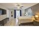 Tranquil main bedroom with a view to the outside, soft colors, and ample space at 643 Oregon Woods Ct, Orlando, FL 32824