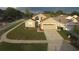 Overhead view of property with manicured lawn, driveway, and nearby street at 1639 Stanbury Dr, Orlando, FL 32818