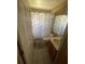 Cozy bathroom with single sink vanity and shower featuring a marble shower curtain at 1639 Stanbury Dr, Orlando, FL 32818