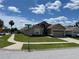 Well-maintained home on a corner lot with a manicured lawn and attached garage at 1639 Stanbury Dr, Orlando, FL 32818