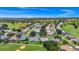 Panoramic aerial view of the home surrounded by a golf community, trees, and manicured lawns at 785 Hawks Bluff, Clermont, FL 34711