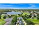 Panoramic view of golf course near a lake surrounded by manicured landscaping and lush greenery at 785 Hawks Bluff, Clermont, FL 34711
