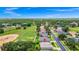 Expansive aerial view of the home in a golf community showing golf course and landscaping at 785 Hawks Bluff, Clermont, FL 34711
