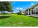 Expansive backyard with lush green grass and views of the golf course at 785 Hawks Bluff, Clermont, FL 34711
