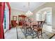 Elegant dining room featuring a chandelier, decorative rug, and classic furniture at 785 Hawks Bluff, Clermont, FL 34711