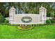 Summit Greens entrance sign with beautiful landscaping at 785 Hawks Bluff, Clermont, FL 34711