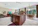 Open concept kitchen with island and dining area, perfect for entertaining in style at 785 Hawks Bluff, Clermont, FL 34711