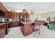 Stylish kitchen with stainless steel appliances, granite countertops, and island seating at 785 Hawks Bluff, Clermont, FL 34711