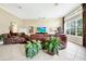 Inviting living room with high ceilings, large windows, and stylish furniture at 785 Hawks Bluff, Clermont, FL 34711