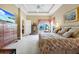 Large main bedroom with tray ceiling, floral bedding, dresser, and large windows with valances at 785 Hawks Bluff, Clermont, FL 34711