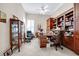 Bright office with a ceiling fan, built-in shelving, and comfortable seating at 785 Hawks Bluff, Clermont, FL 34711