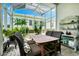 Charming screened-in patio with brick flooring, perfect for outdoor dining and relaxation at 785 Hawks Bluff, Clermont, FL 34711