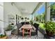 Screened patio with a table, chairs, and decorative accents at 785 Hawks Bluff, Clermont, FL 34711