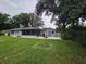 Enjoy this peaceful backyard with a screen patio and mature trees offering plenty of shade at 1405 Ridgegreen N Loop, Lakeland, FL 33809