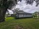 Beautiful single story home featuring lush landscaping, a private backyard, and stone accents at 1405 Ridgegreen N Loop, Lakeland, FL 33809