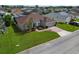 Aerial of home with manicured lawn and landscaping with a two car garage at 344 Barbera Dr, Davenport, FL 33897