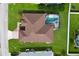 Aerial view of the home featuring a screened pool and landscaped yard in a residential neighborhood at 344 Barbera Dr, Davenport, FL 33897