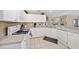 Bright kitchen with white appliances, ample counter space, and tiled flooring at 344 Barbera Dr, Davenport, FL 33897