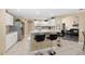 Well-appointed kitchen with white cabinets, stainless steel appliances, and breakfast bar seating at 344 Barbera Dr, Davenport, FL 33897
