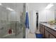 Elegant bathroom featuring a glass shower, granite countertop, and walk-in closet at 311 Pop Top Ln, Daytona Beach, FL 32124