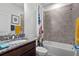 Full bathroom with a shower-tub combo and granite countertop vanity at 311 Pop Top Ln, Daytona Beach, FL 32124