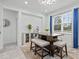 Bright dining area with ample light, a table with seating, and modern accents for cozy meals at 311 Pop Top Ln, Daytona Beach, FL 32124
