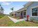 Street view of cottage-style homes, landscaped front yards, and pedestrian-friendly sidewalk at 311 Pop Top Ln, Daytona Beach, FL 32124