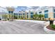 Exterior view of community fitness center with ample parking and palm trees at 311 Pop Top Ln, Daytona Beach, FL 32124