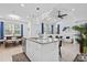 Modern kitchen with granite countertops, stainless steel appliances, and open layout to the living room at 311 Pop Top Ln, Daytona Beach, FL 32124