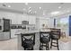 Granite counters, stainless appliances, and pendant lighting highlight this modern open kitchen space at 311 Pop Top Ln, Daytona Beach, FL 32124