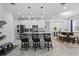 Spacious kitchen and dining area with granite countertops, stainless steel appliances, and stylish seating at 311 Pop Top Ln, Daytona Beach, FL 32124