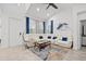 Bright living room with vaulted ceiling, plush white sofa, stylish coffee table and modern decor at 311 Pop Top Ln, Daytona Beach, FL 32124