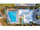 Aerial view of pool area with lounge chairs and umbrellas at 311 Pop Top Ln, Daytona Beach, FL 32124