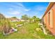 A sprawling backyard with lush greenery and ample space, ideal for relaxation and recreation at 675 Elbridge Dr, Kissimmee, FL 34758