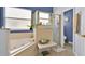 Well-appointed bathroom with a soaking tub and glass-enclosed shower at 675 Elbridge Dr, Kissimmee, FL 34758