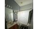 Cozy bathroom with a shower, a toilet, and a vanity with drawers at 675 Elbridge Dr, Kissimmee, FL 34758
