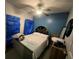Bedroom with a ceiling fan and a decorated headboard is staged for a sale at 675 Elbridge Dr, Kissimmee, FL 34758