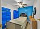 Cozy bedroom featuring a ceiling fan, creating a relaxing atmosphere at 675 Elbridge Dr, Kissimmee, FL 34758