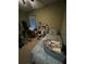 This bedroom is equipped with workout equipment, cozy interior and natural light at 675 Elbridge Dr, Kissimmee, FL 34758