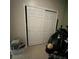 Full closet with sliding doors and a globe next to the frame at 675 Elbridge Dr, Kissimmee, FL 34758