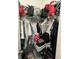 View of a stuffed walk-in closet, great for storage at 675 Elbridge Dr, Kissimmee, FL 34758