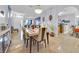Open-concept dining room featuring a dining table and view of adjacent living space at 675 Elbridge Dr, Kissimmee, FL 34758