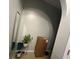Small entryway under an archway with decorative plants and a mirror at 675 Elbridge Dr, Kissimmee, FL 34758