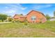 Well-maintained single-Gathering home with lush greenery and mature plants, enhancing the property's allure at 675 Elbridge Dr, Kissimmee, FL 34758