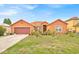 Charming single-Gathering home with a well-manicured lawn and mature landscaping, creating inviting curb appeal at 675 Elbridge Dr, Kissimmee, FL 34758