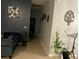 Hallway with neutral walls and decorations at 675 Elbridge Dr, Kissimmee, FL 34758