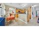 An open-concept kitchen featuring stainless steel appliances, ample counter space, and modern cabinetry at 675 Elbridge Dr, Kissimmee, FL 34758