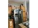 Kitchen with wooden cabinets and stainless steel refrigerator at 675 Elbridge Dr, Kissimmee, FL 34758