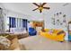 Spacious living room with tile floors and large windows for ample light at 675 Elbridge Dr, Kissimmee, FL 34758